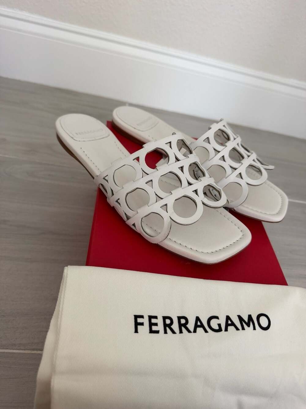 Ferragamo Erne Doha Laser-Cut Gancini Slide Sandals in White/ivory